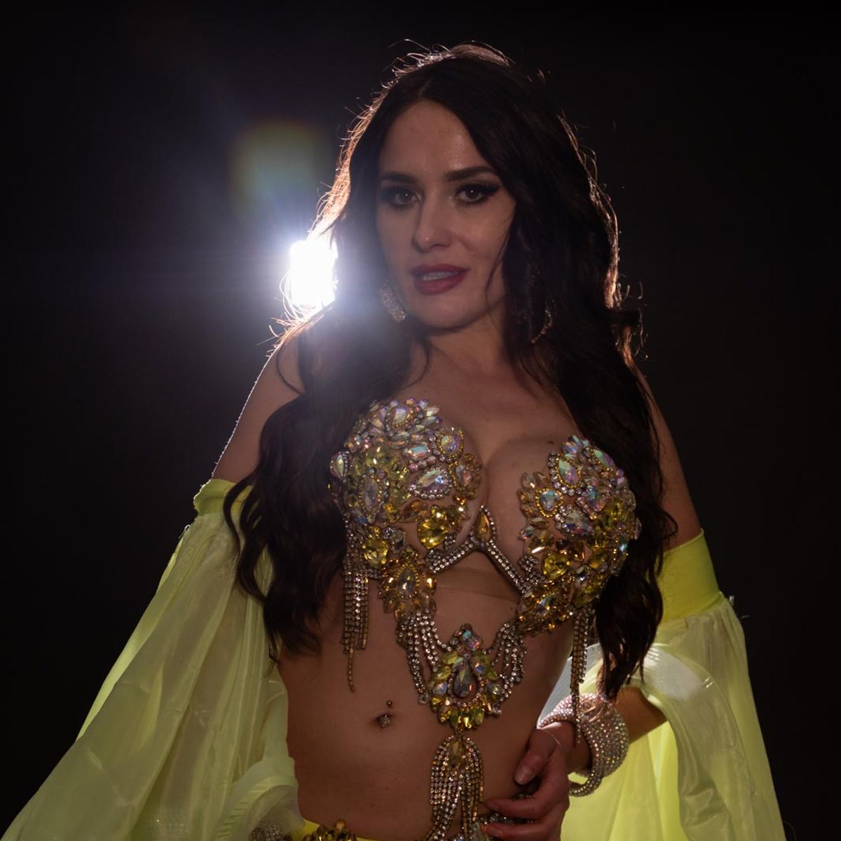 Lime jeweled costume portrait with studio backlight